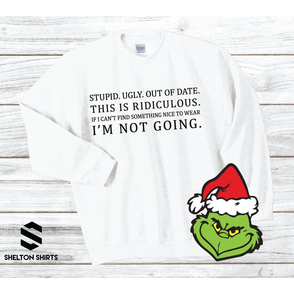 Stupid. Ugly. Out of date. If I can’t find something nice to wear. I’m not going Grinch Sweatshirt