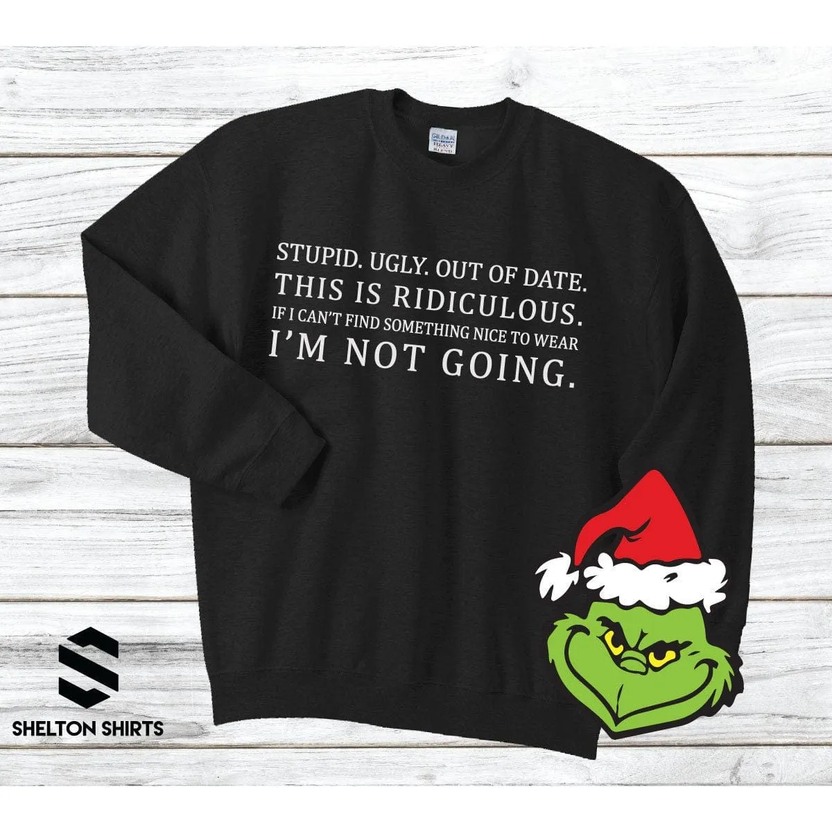 Stupid. Ugly. Out of date. If I can’t find something nice to wear. I’m not going Grinch Sweatshirt